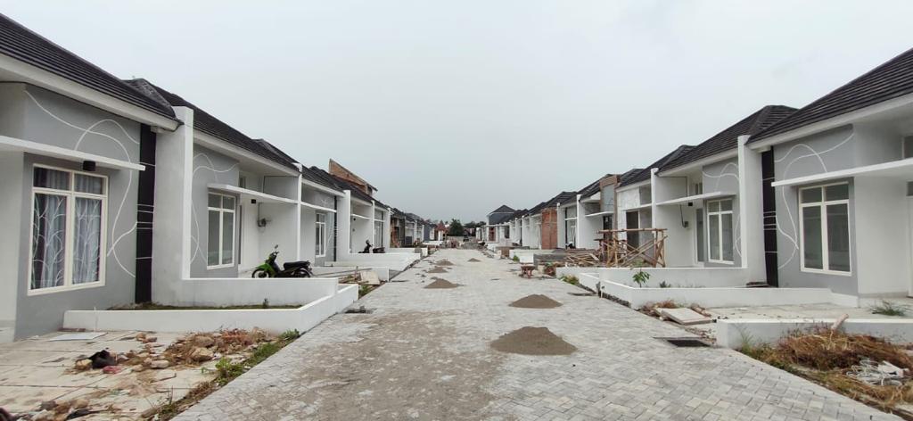 A photograph of homes being built in Indonesia using plastic waste collected on behalf of Logistics Plus.